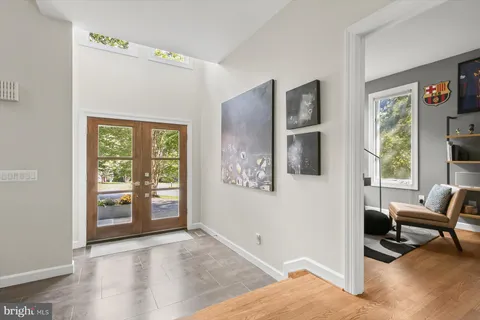 a bedroom with a large bed and a couch