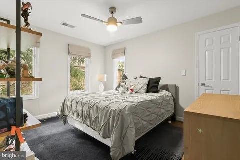 a view of a patio with a table and chairs under an umbrella