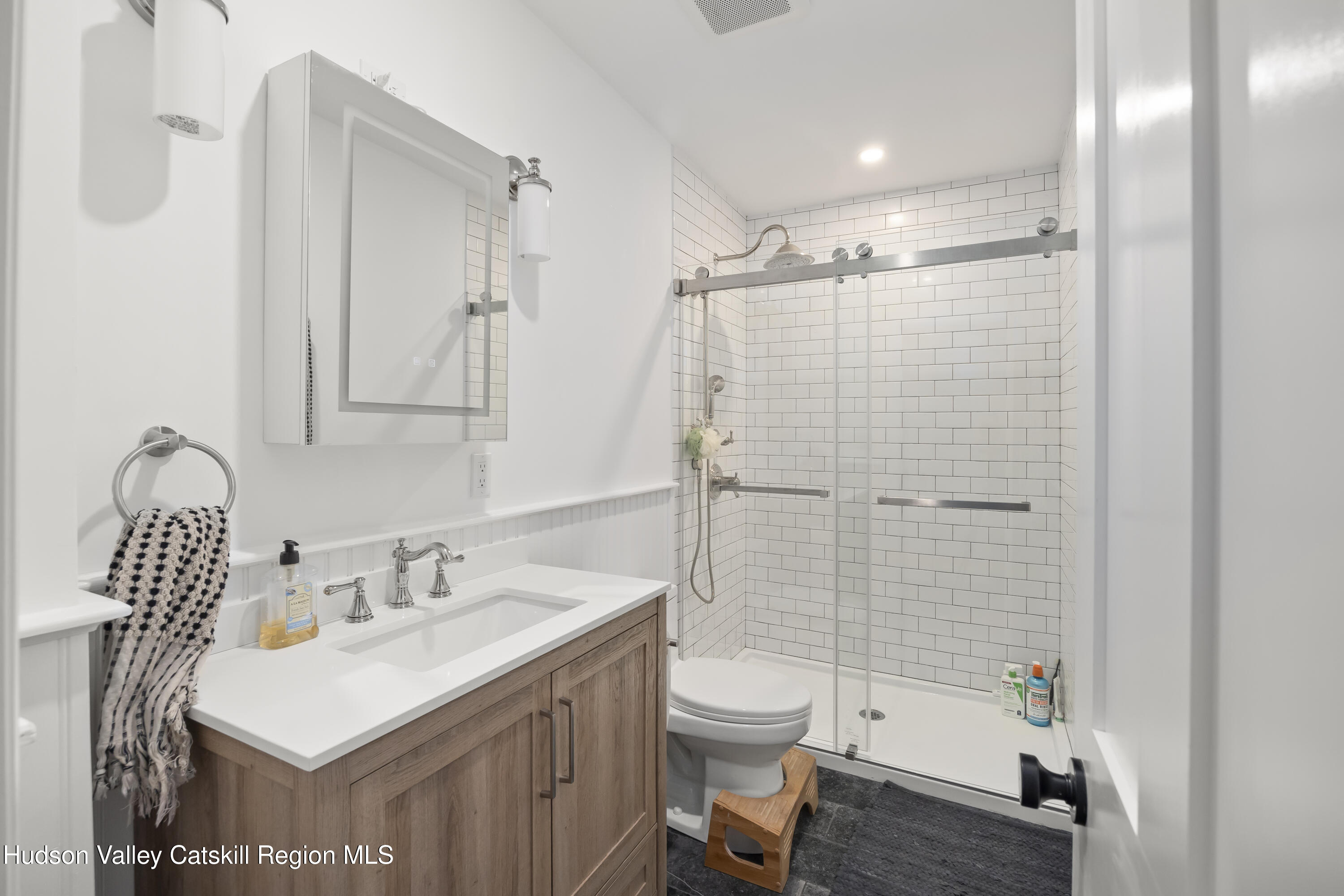 417 Warren Street, Unit A Hudson, NY 12534 - Photo 12 of 19 a bathroom with a sink toilet and shower