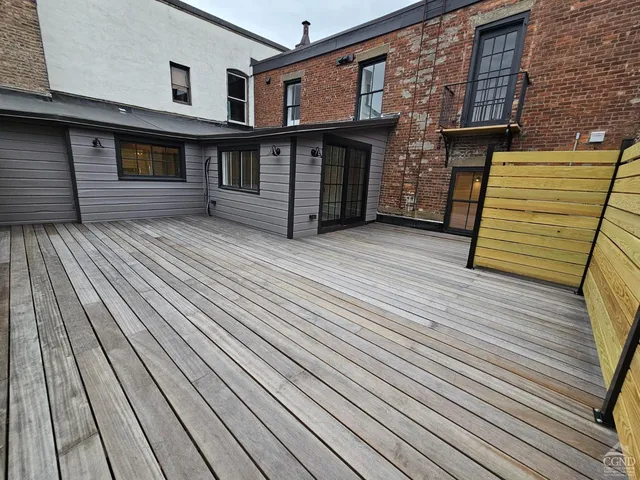 front view of a house with wooden floor