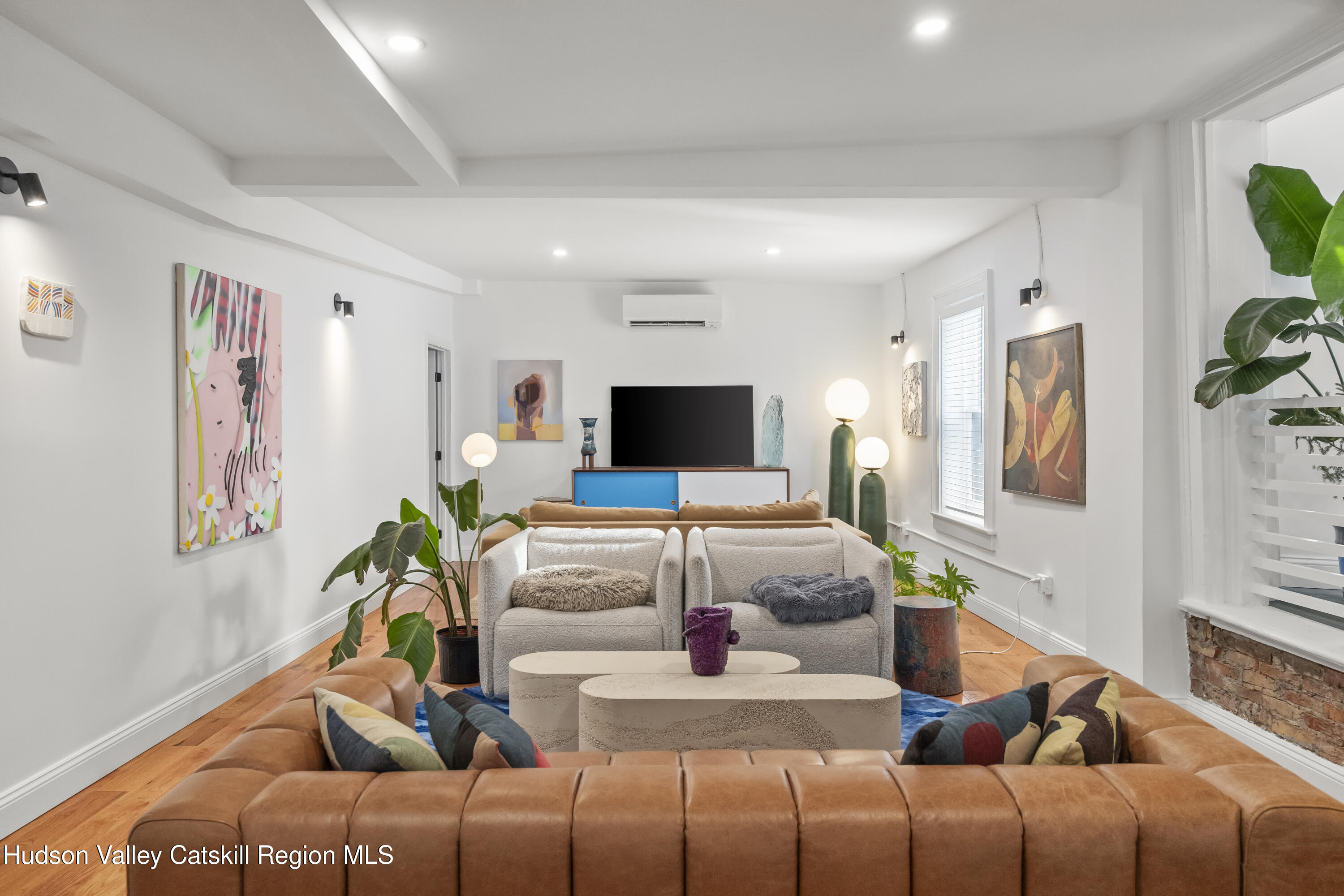 417 Warren Street, Unit A Hudson, NY 12534 - Photo 3 of 19 a living room with furniture and a flat screen tv