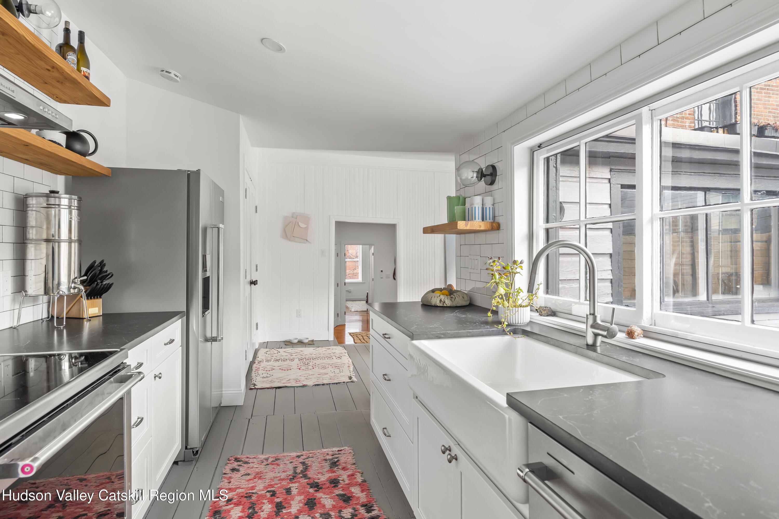 417 Warren Street, Unit A Hudson, NY 12534 - Photo 8 of 19 a kitchen with a sink stove and refrigerator