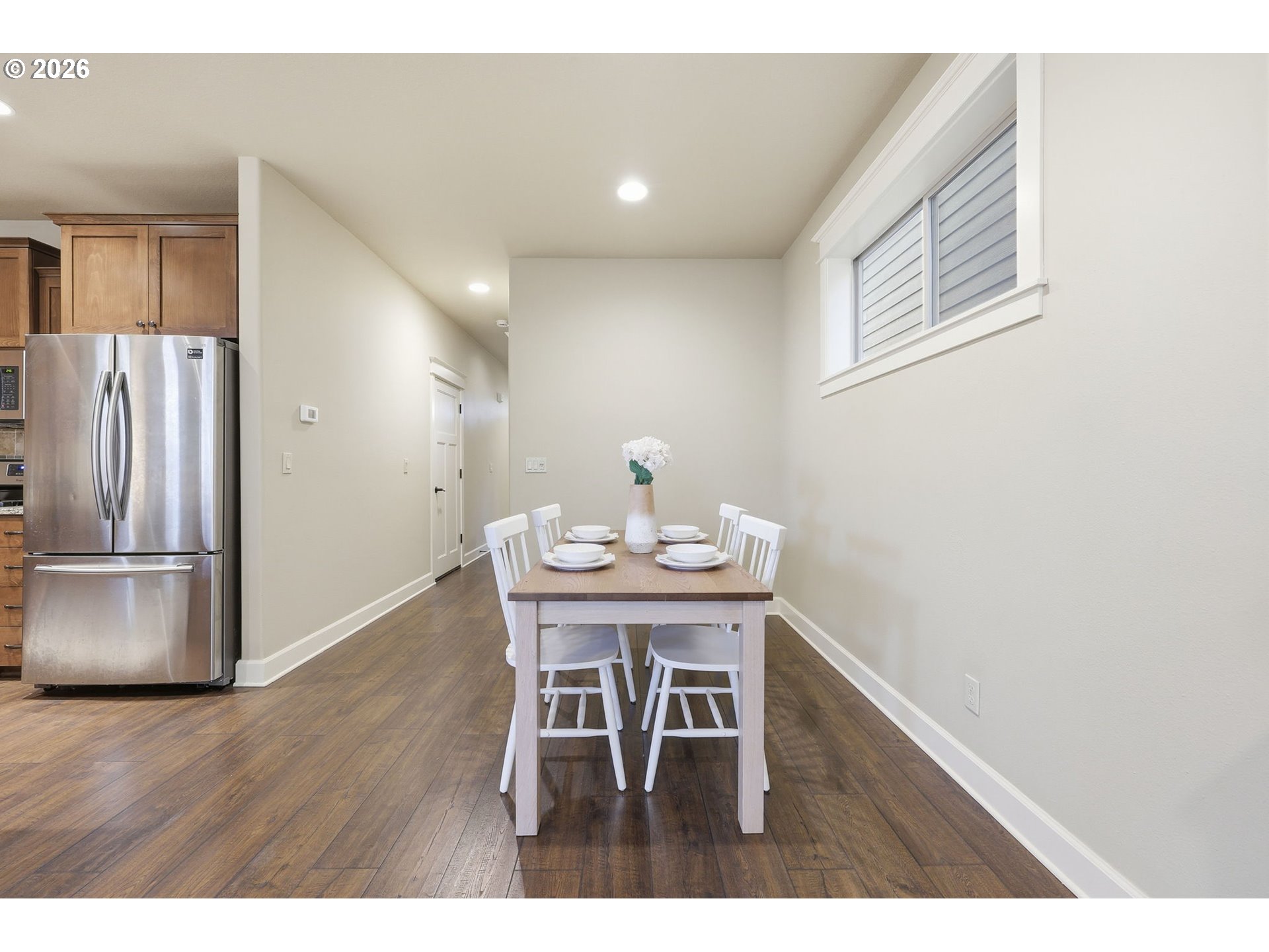 11033 Southwest Legacy Oak Way Portland, OR 97223 - Photo 13 of 47 a view of a dining room with furniture and a chandelier