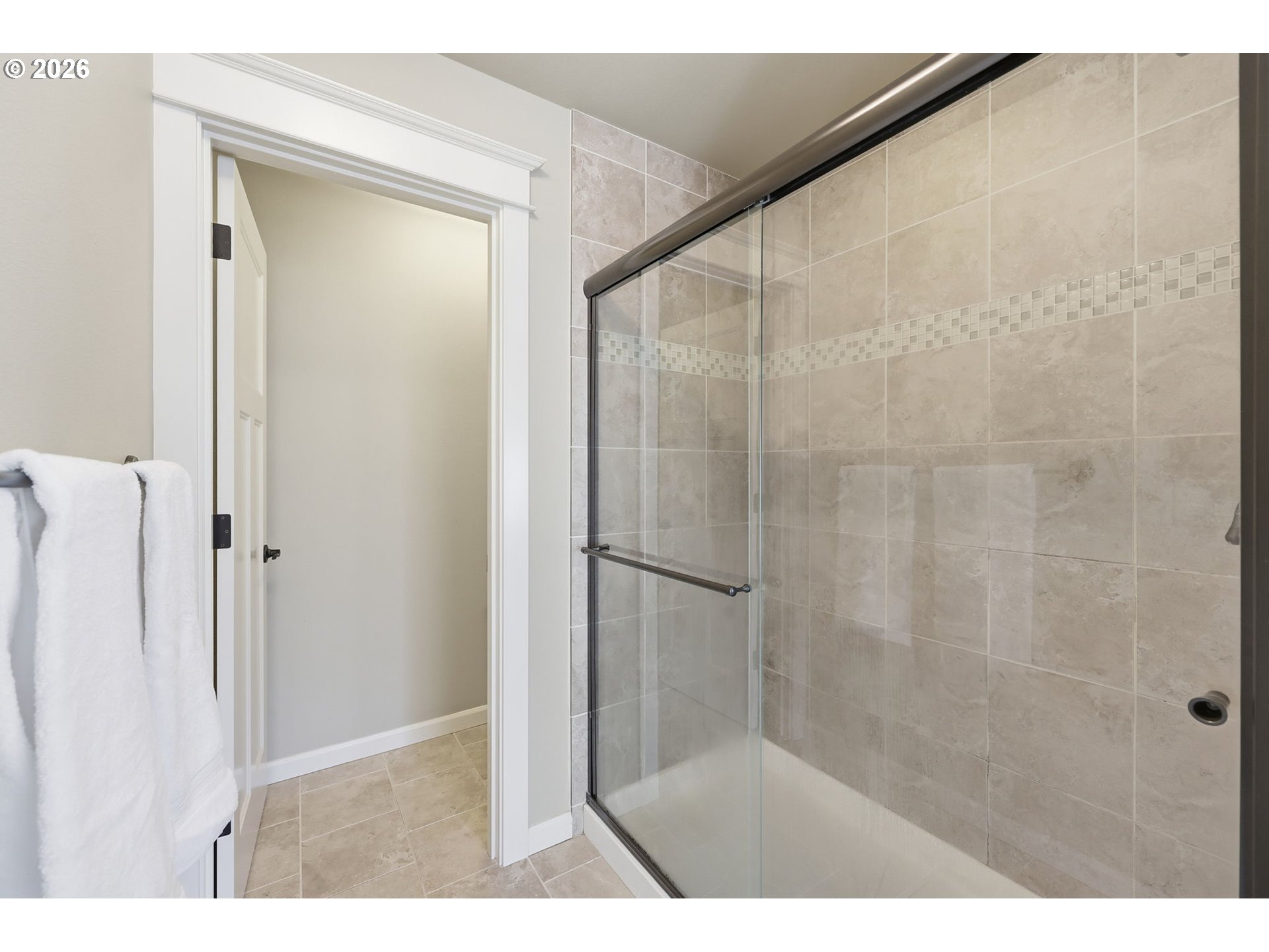 11033 Southwest Legacy Oak Way Portland, OR 97223 - Photo 22 of 47 a bathroom with a glass shower door