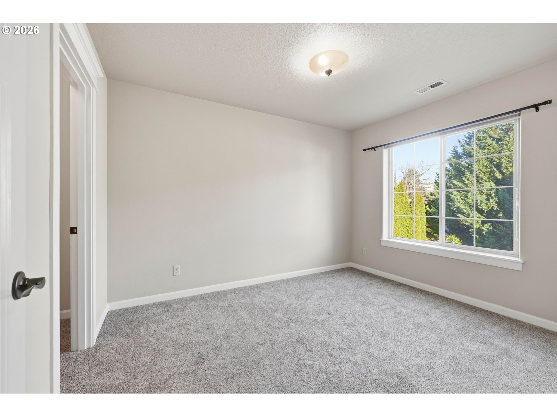 11033 Southwest Legacy Oak Way Portland, OR 97223 - Photo 27 of 47 a view of an empty room with a window