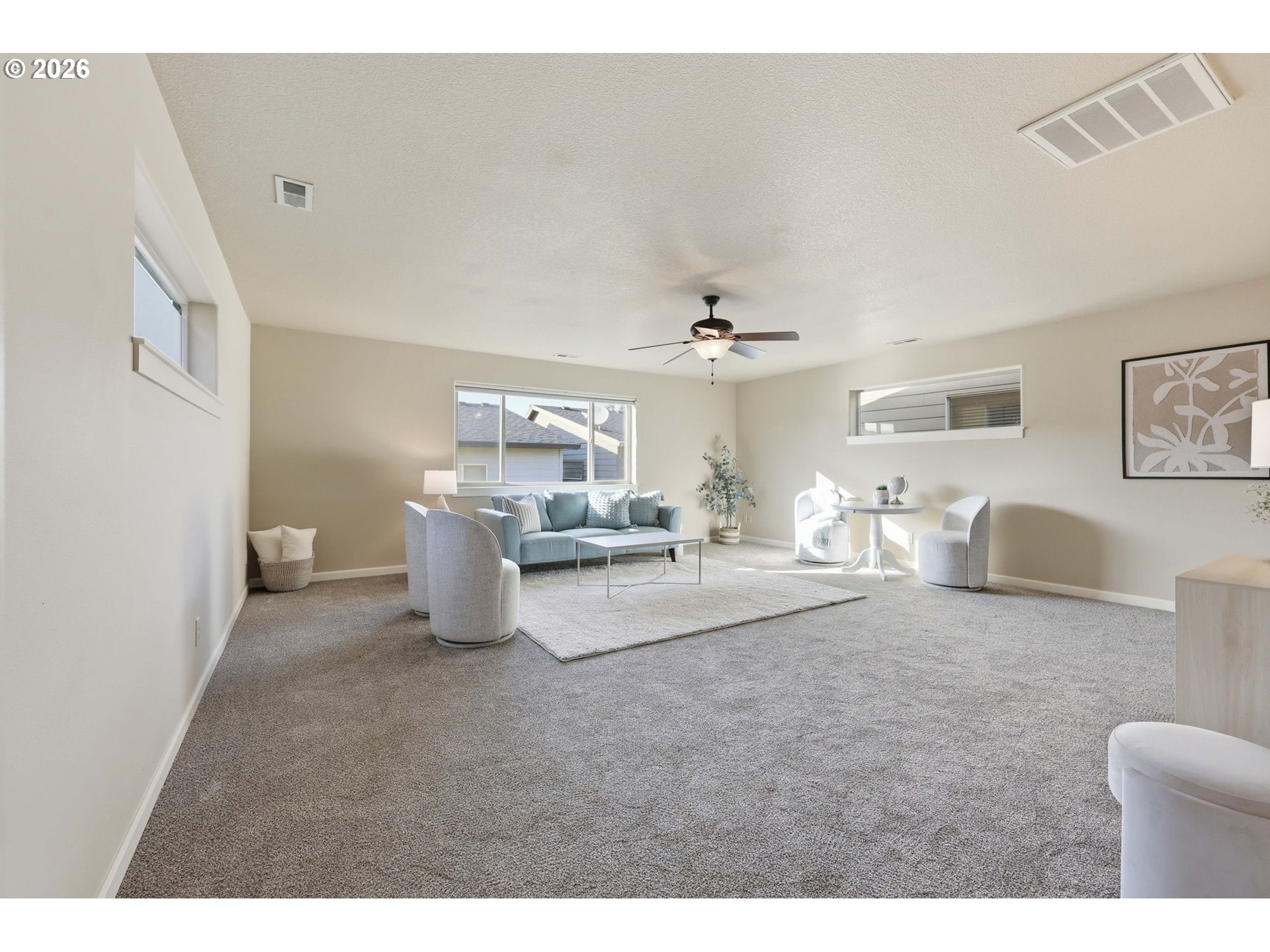 11033 Southwest Legacy Oak Way Portland, OR 97223 - Photo 31 of 47 a living room with furniture and a chandelier