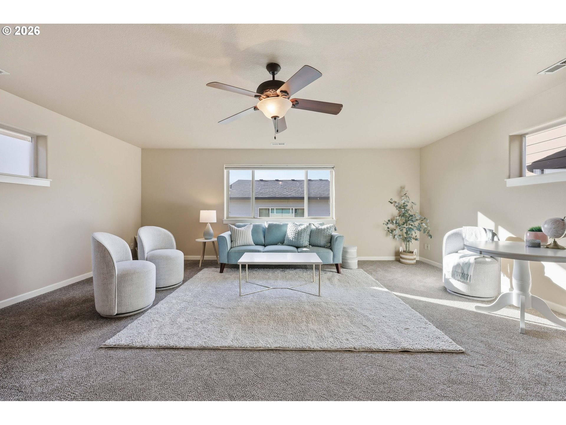 11033 Southwest Legacy Oak Way Portland, OR 97223 - Photo 32 of 47 a living room with furniture and a chandelier