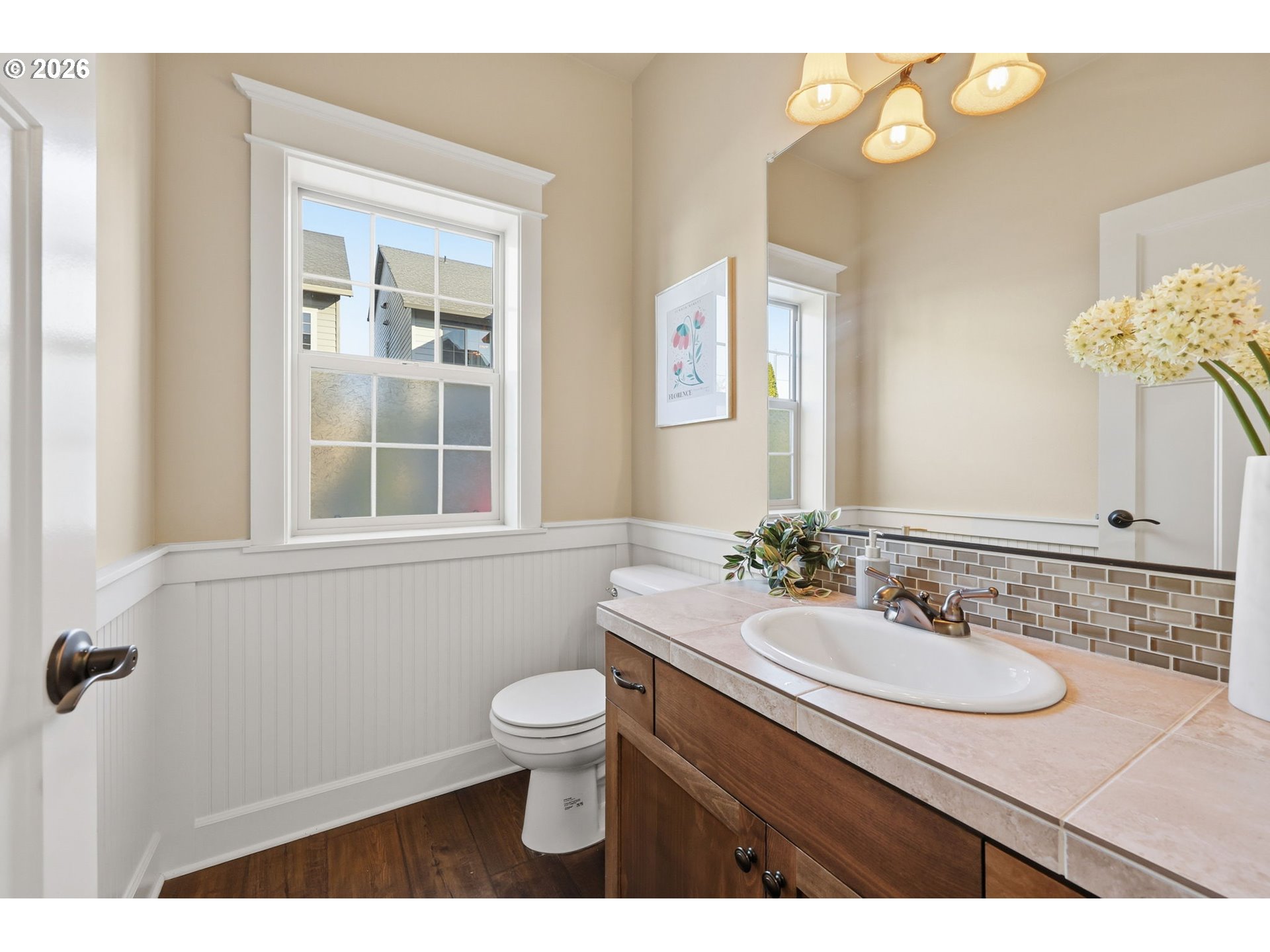 11033 Southwest Legacy Oak Way Portland, OR 97223 - Photo 46 of 47 a bathroom with a sink a toilet and a mirror