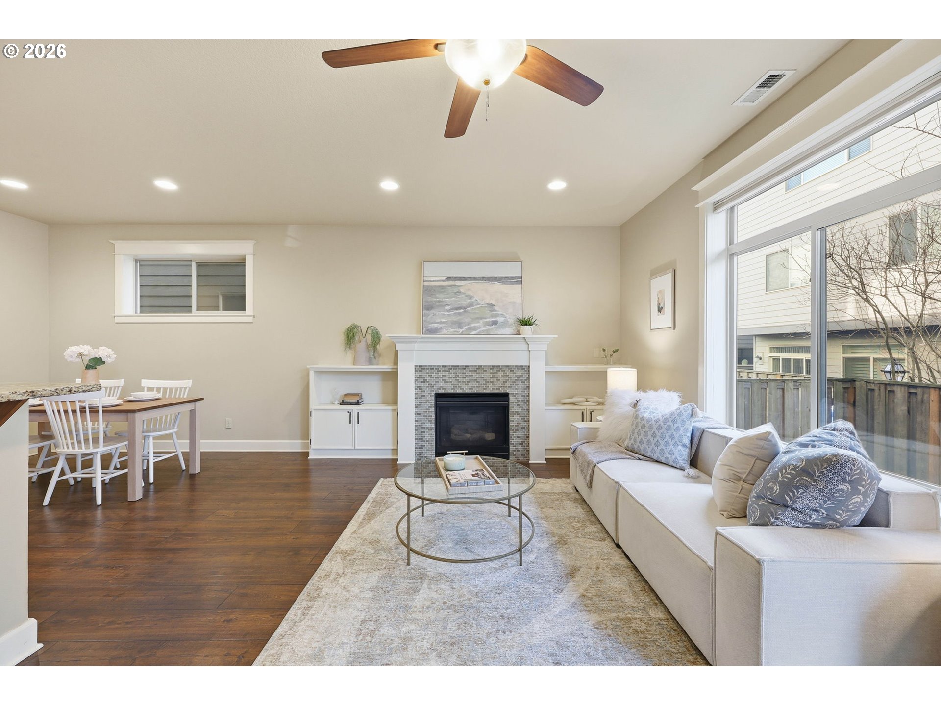 11033 Southwest Legacy Oak Way Portland, OR 97223 - Photo 7 of 47 a living room with furniture a fireplace and a table