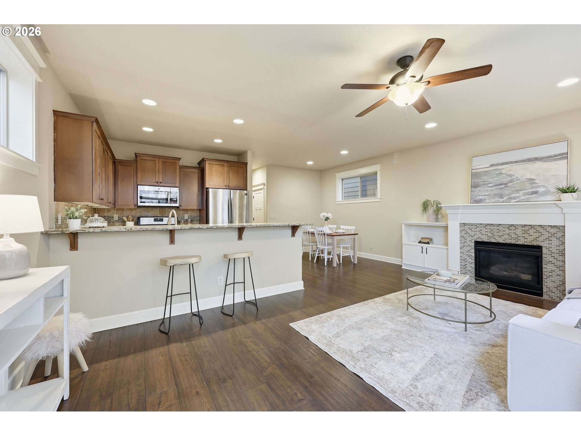 11033 Southwest Legacy Oak Way Portland, OR 97223 - Photo 8 of 47 a living room with furniture and kitchen view