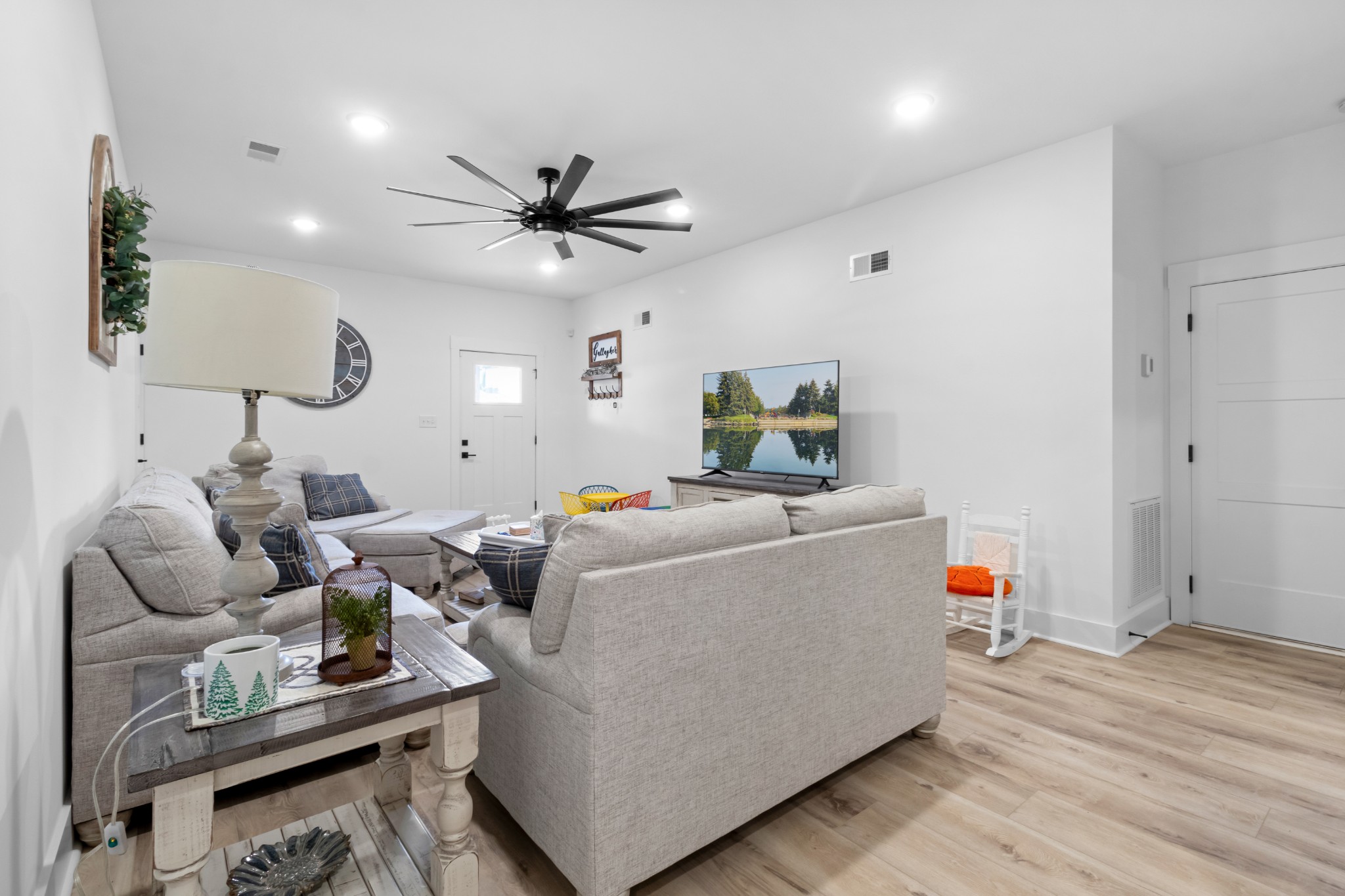 1188 Wicke Road Adams, TN 37010 - Photo 31 of 47 a living room with furniture and a wooden floor