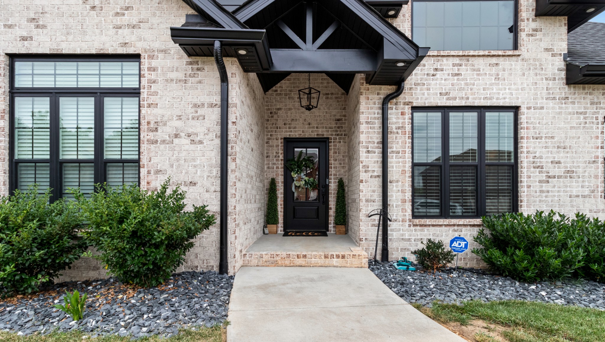 1188 Wicke Road Adams, TN 37010 - Photo 4 of 47 a front view of a house with garden