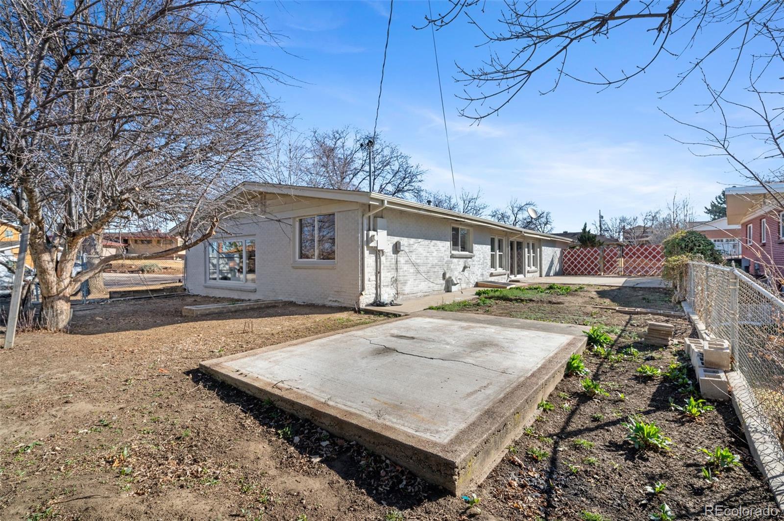 4481 Carr Street Wheat Ridge, CO 80033 - Photo 27 of 30 a front view of a house with yard