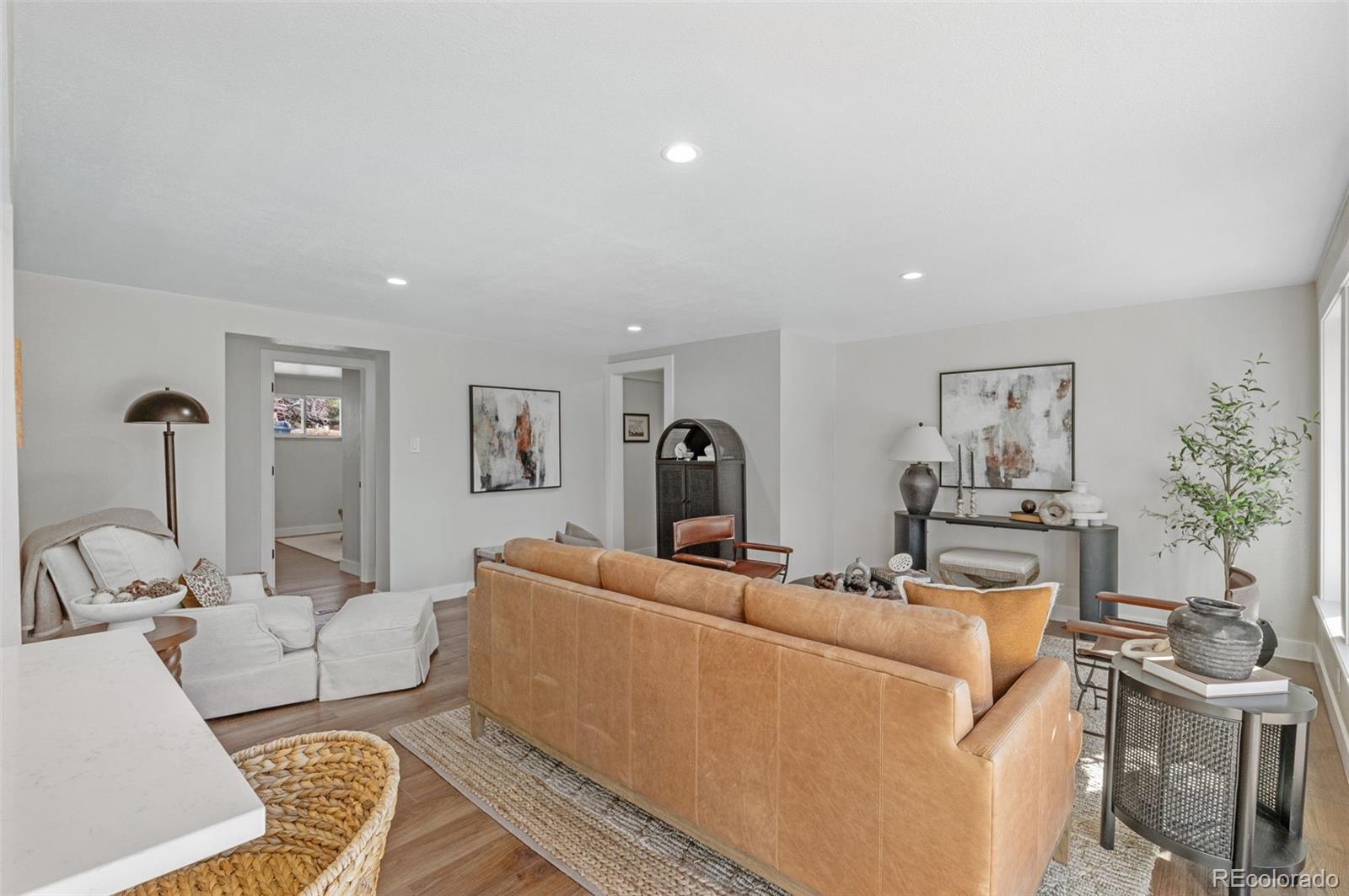 4481 Carr Street Wheat Ridge, CO 80033 - Photo 8 of 30 a living room with furniture and a couch
