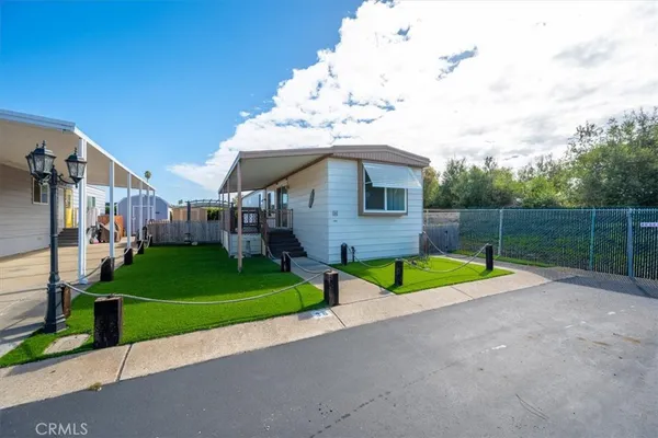 a view of backyard with trampoline