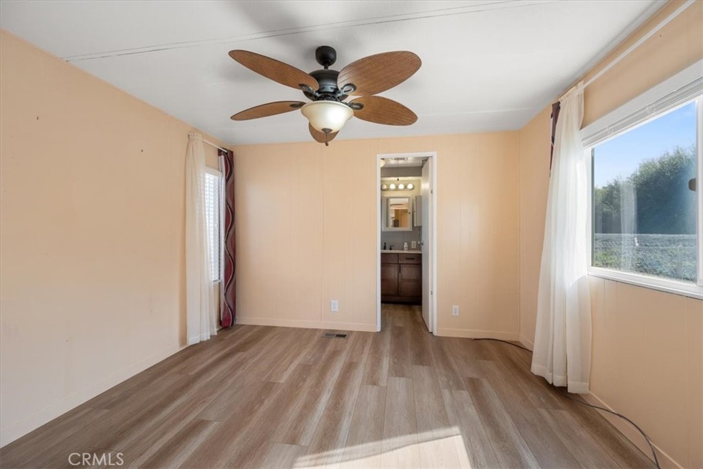 2300 Cienaga Street, Unit 36 Oceano, CA 93445 - Photo 17 of 39 wooden floor in an empty room with a window