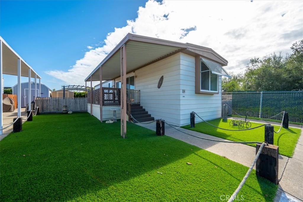 2300 Cienaga Street, Unit 36 Oceano, CA 93445 - Photo 2 of 39 a view of a house with a yard
