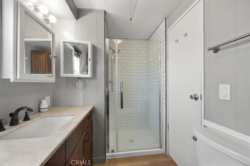 2300 Cienaga Street, Unit 36 Oceano, CA 93445 - Photo 21 of 39 a bathroom with a shower sink and mirror