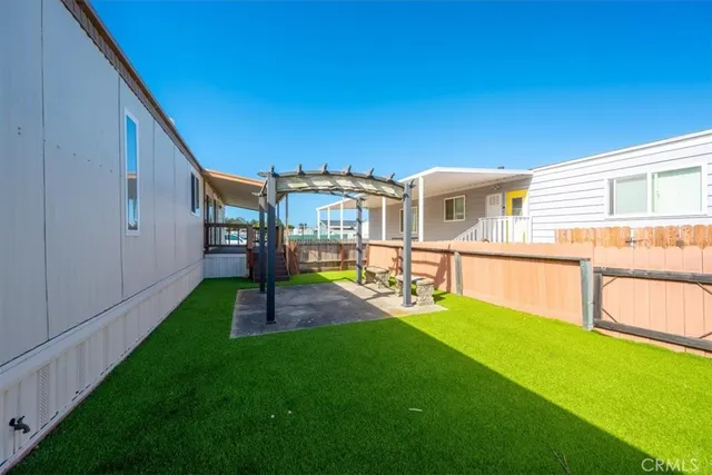 a house view with a backyard space