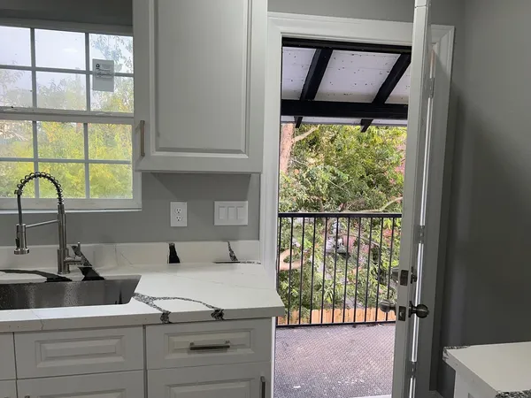 a view of a sink and a window