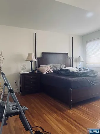 a room with a bed and a night stand