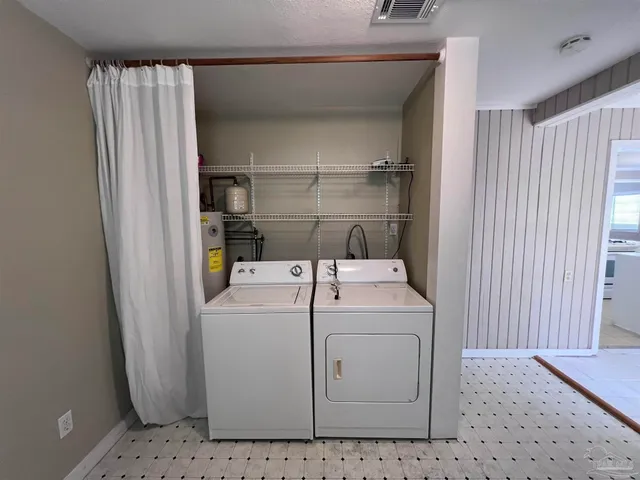 a view of a house with a wooden deck