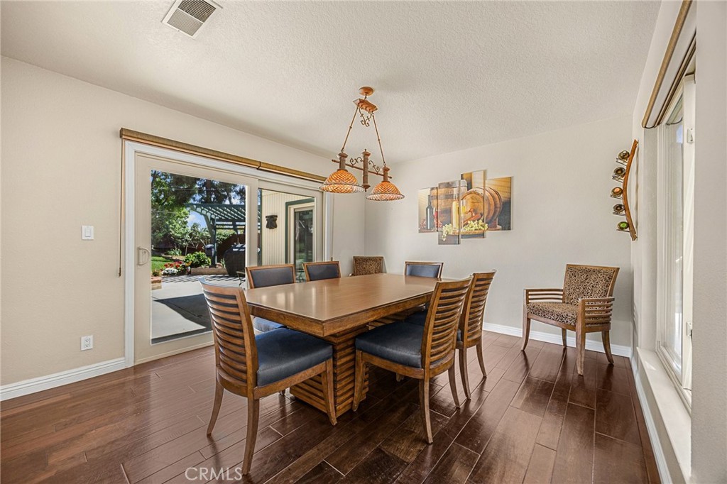 1412 Alta Mesa Way Brea, CA 92821 - Photo 13 of 50 a dining room with furniture window and wooden floor