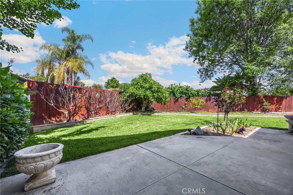 1412 Alta Mesa Way Brea, CA 92821 - Photo 20 of 50 a view of a backyard with plants and a garden