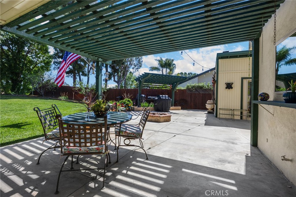 1412 Alta Mesa Way Brea, CA 92821 - Photo 22 of 50 a patio with a table and chairs and a barbeque