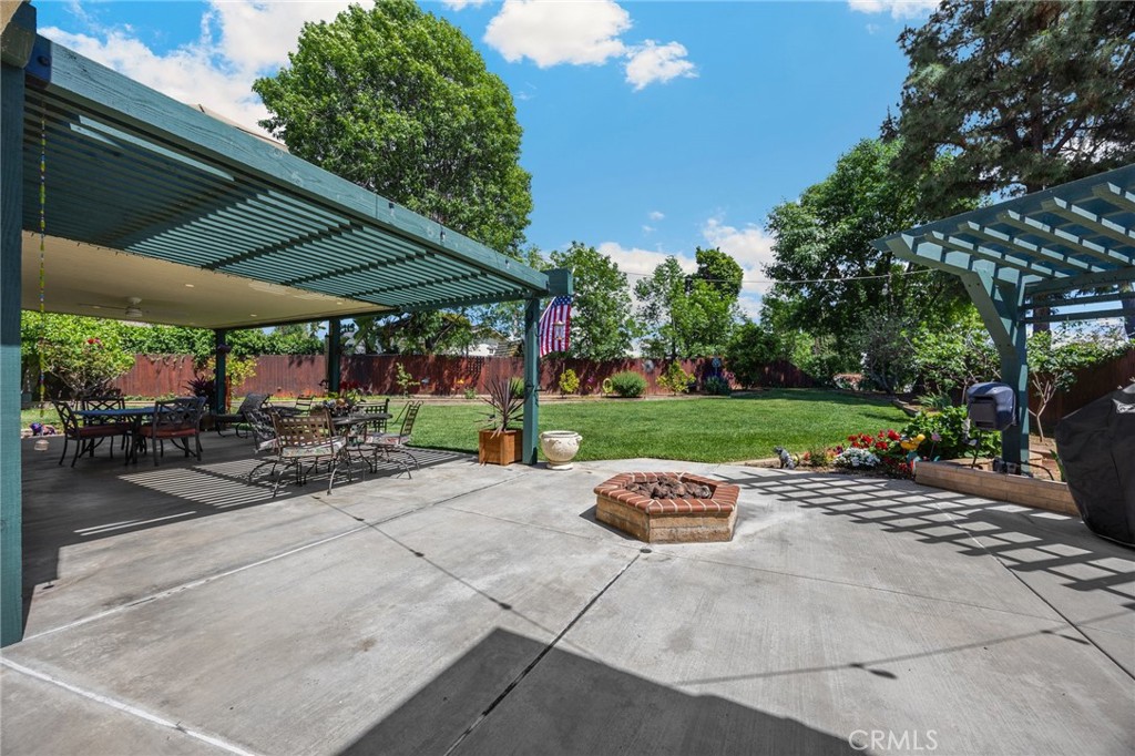 1412 Alta Mesa Way Brea, CA 92821 - Photo 23 of 50 a view of a patio with a table and chairs under an umbrella