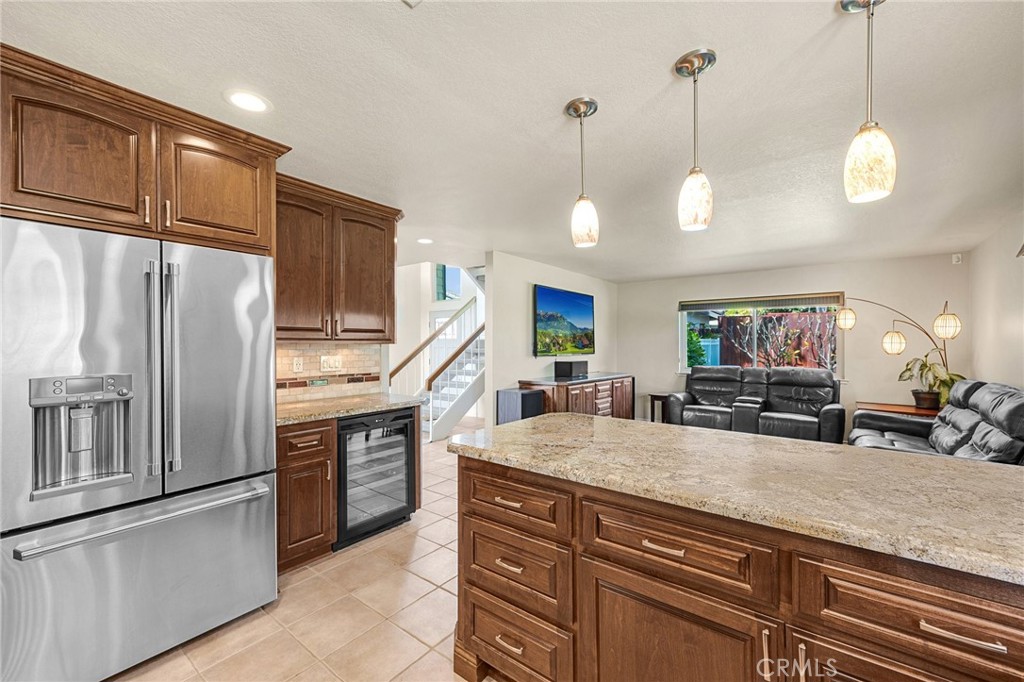 1412 Alta Mesa Way Brea, CA 92821 - Photo 28 of 50 a kitchen with stainless steel appliances granite countertop a sink refrigerator and cabinets