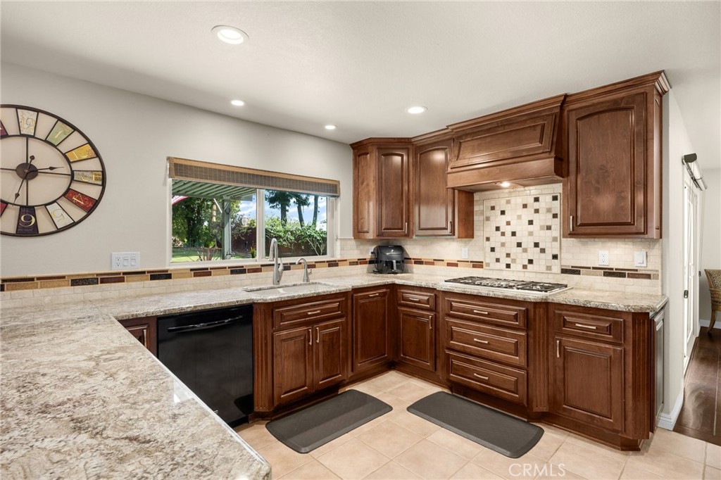 1412 Alta Mesa Way Brea, CA 92821 - Photo 31 of 50 a kitchen with a sink and cabinets