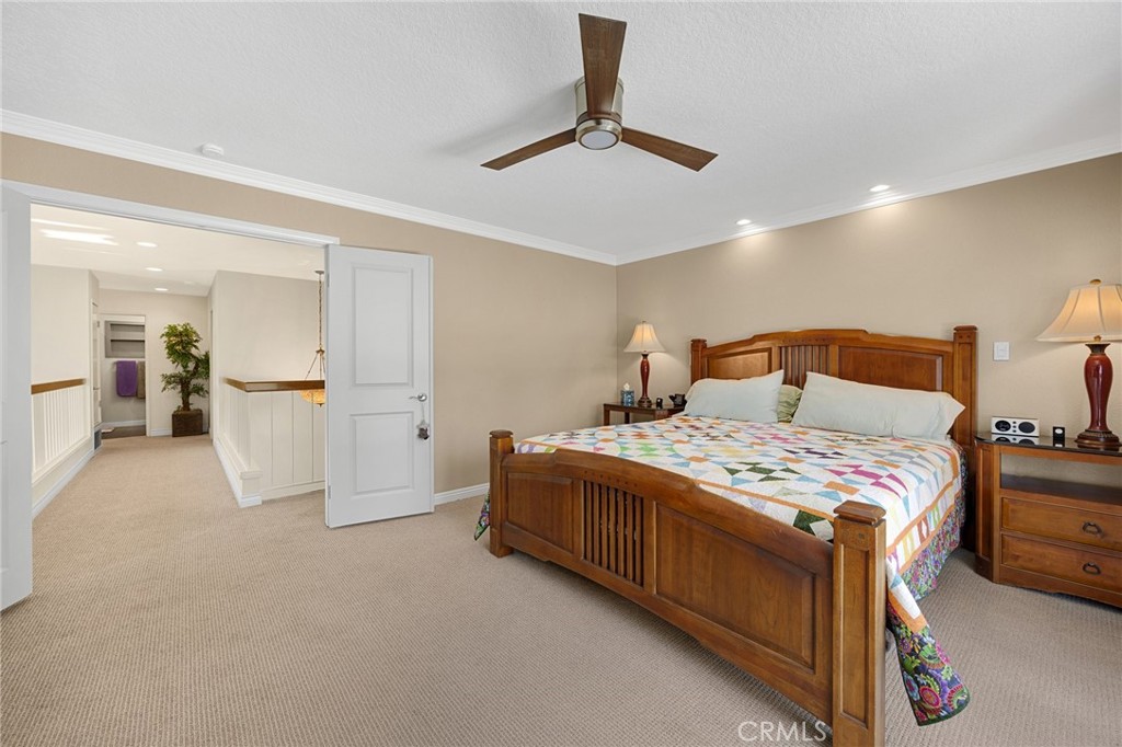 1412 Alta Mesa Way Brea, CA 92821 - Photo 37 of 50 a bedroom with a bed and a chandelier