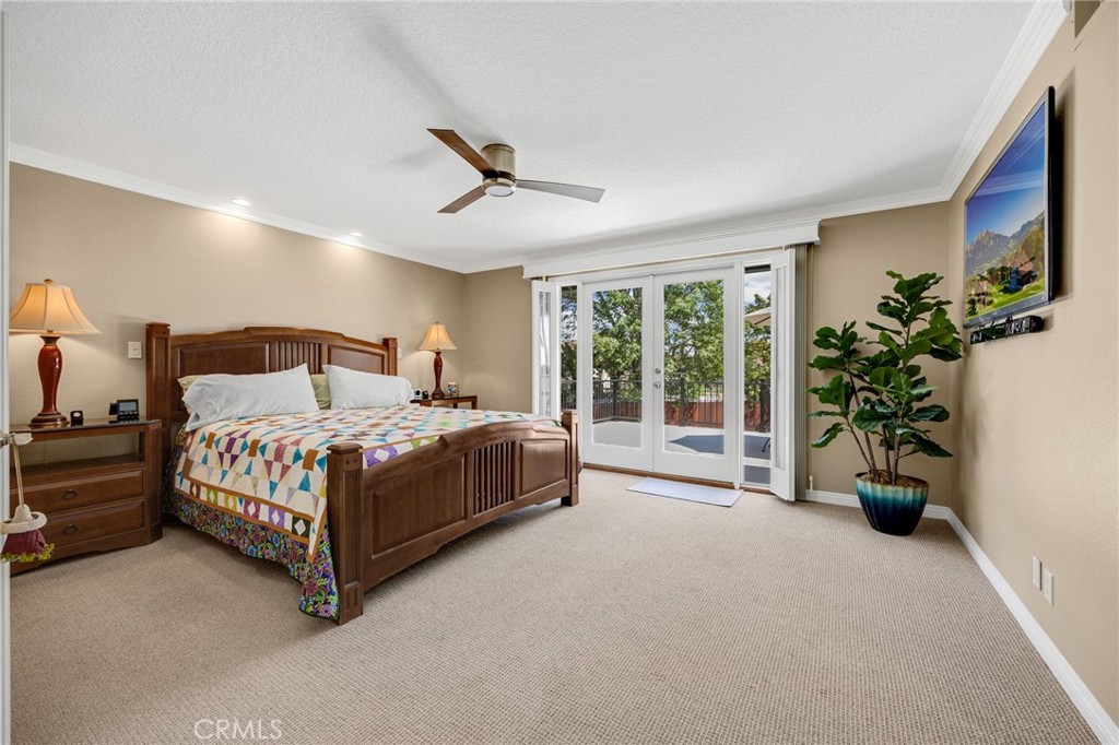 1412 Alta Mesa Way Brea, CA 92821 - Photo 38 of 50 a bedroom with a large bed and a potted plant