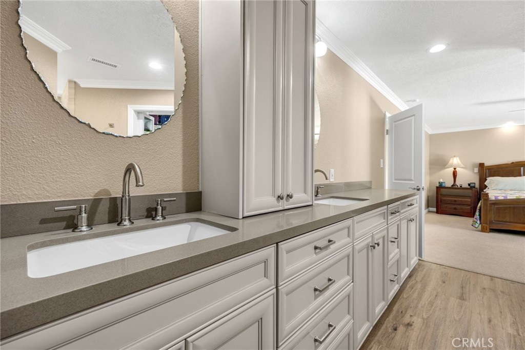 1412 Alta Mesa Way Brea, CA 92821 - Photo 42 of 50 a bathroom with double vanity sinks and a mirror