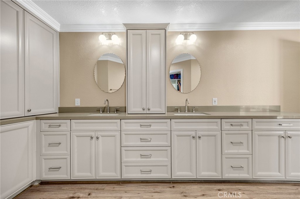 1412 Alta Mesa Way Brea, CA 92821 - Photo 44 of 50 a bathroom with a double vanity sink and a mirror
