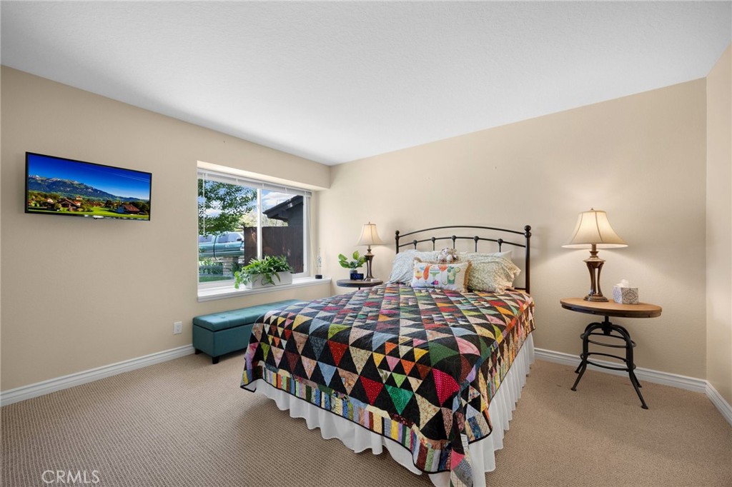 1412 Alta Mesa Way Brea, CA 92821 - Photo 7 of 50 a bedroom with a bed and a lamp with window