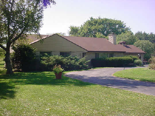 4627 Guilford Road Rockford, IL 61107 - Photo 1 of 1 a front view of a house with garden