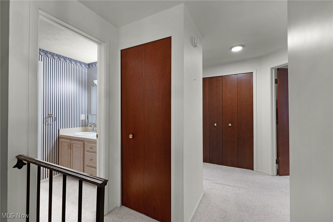 6474 State Road, Unit I10 Parma, OH 44134 - Photo 21 of 31 Hallway with carpet and a sink
