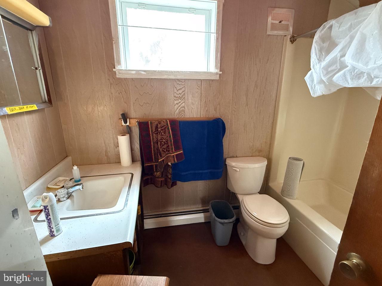 1 Prospect Road Strasburg, PA 17579 - Photo 12 of 66 a white toilet sitting next to a bathroom sink