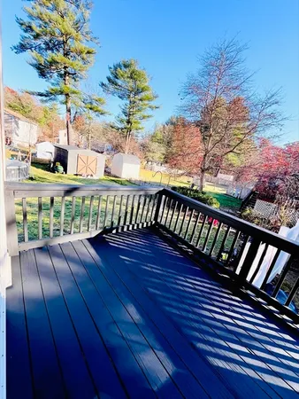 a view of a balcony with wooden floor