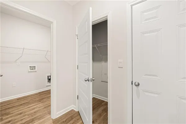 a view of a bathroom with wooden floor