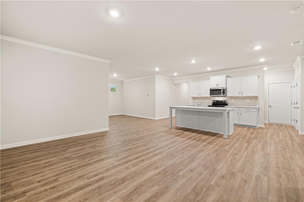 1171 Kingston Road Buckhead, GA 30625 - Photo 17 of 34 a view of kitchen with wooden floor and window