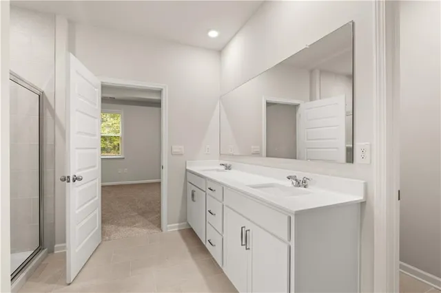 a white bath tub sitting next to a shower