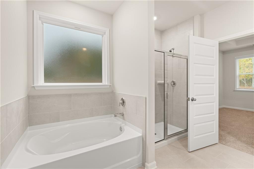 1171 Kingston Road Buckhead, GA 30625 - Photo 20 of 34 a white bath tub sitting next to a shower
