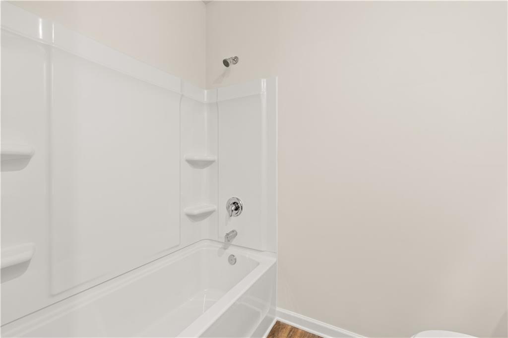 1171 Kingston Road Buckhead, GA 30625 - Photo 24 of 34 a bathroom with a bathtub