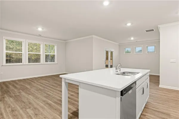 a utility room with a sink washer and dryer