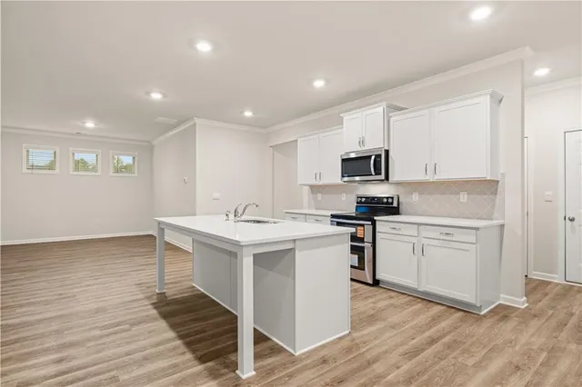 a utility room with a sink washer and dryer
