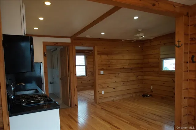 a bathroom with a glass door shower and a sink