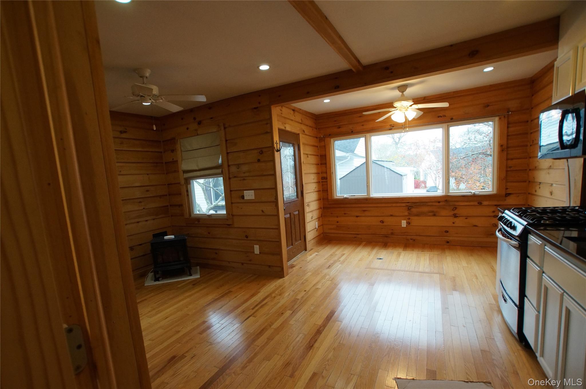 12 East Tiana Road, Unit 6 Hampton Bays, NY 11946 - Photo 6 of 9 a view of a living room and a kitchen